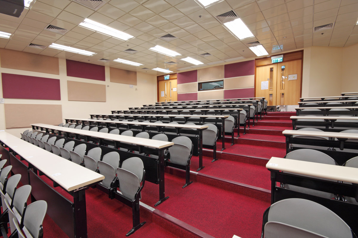 Empty hall for presentation with grey armchairs